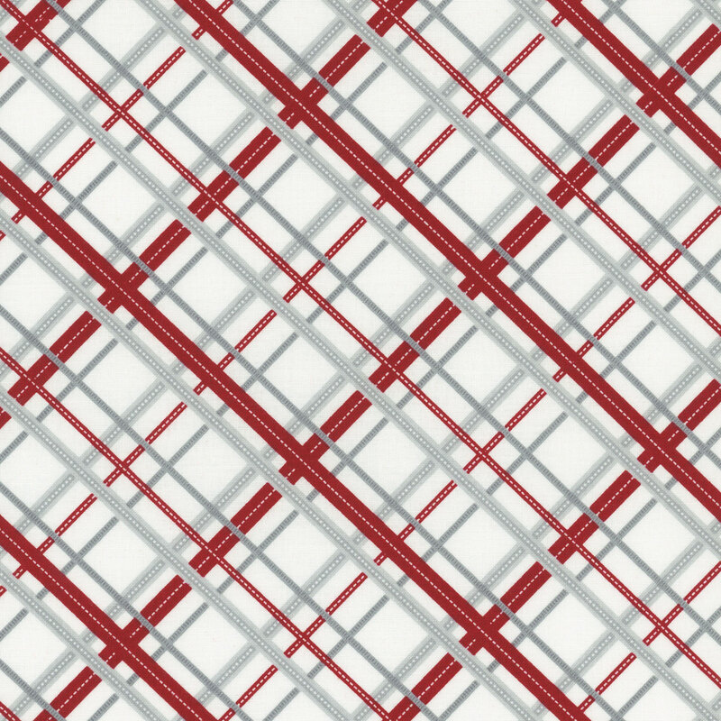 White fabric with a red and gray diagonal plaid design.