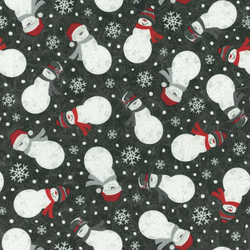 Black fabric with tossed snowflakes and snowmen dressed in winter wear on a tonal frost background.