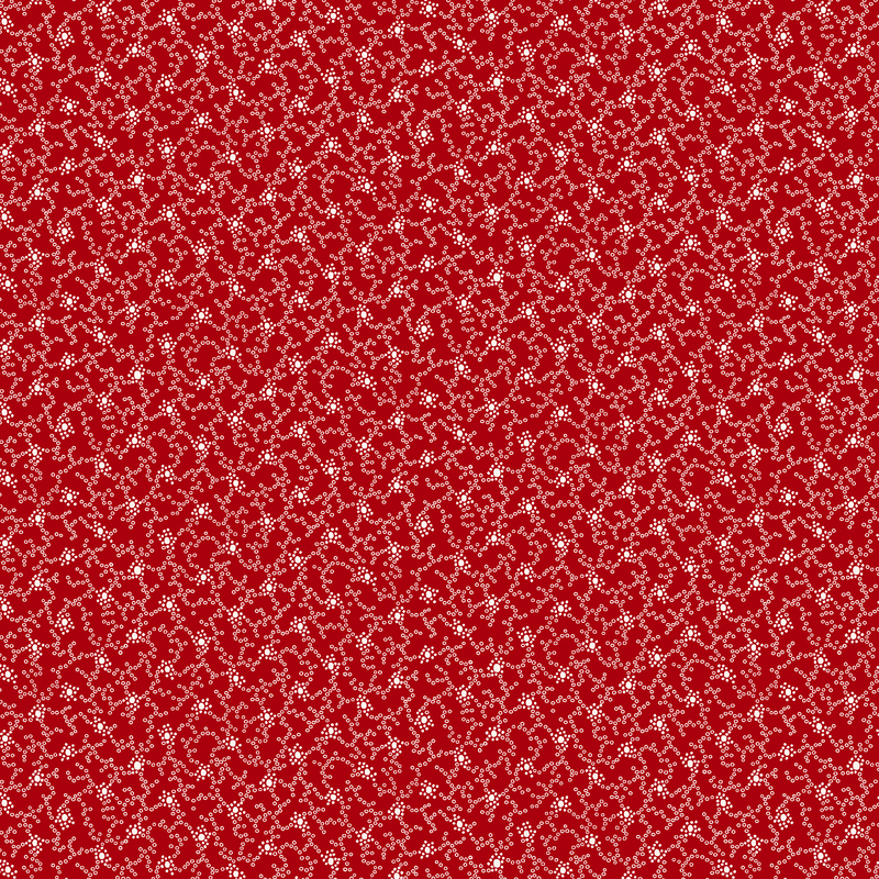 Red fabric with a repeating abstract white texture pattern.