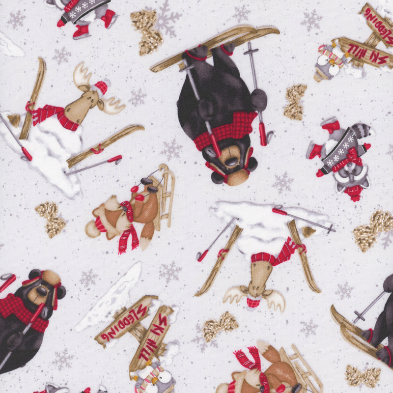 Light gray fabric with tossed woodland animals sledding, ice skating, and skiing on a snowflake-strewn background.