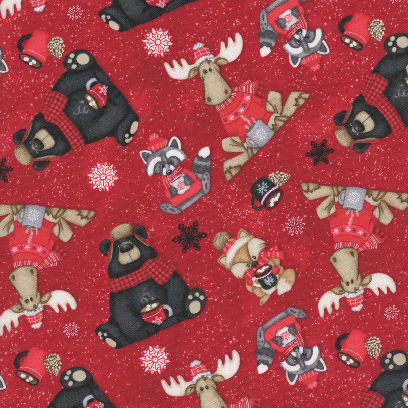 Cherry red fabric with tossed bears, moose, raccoons, and foxes on a paint-flecked background.