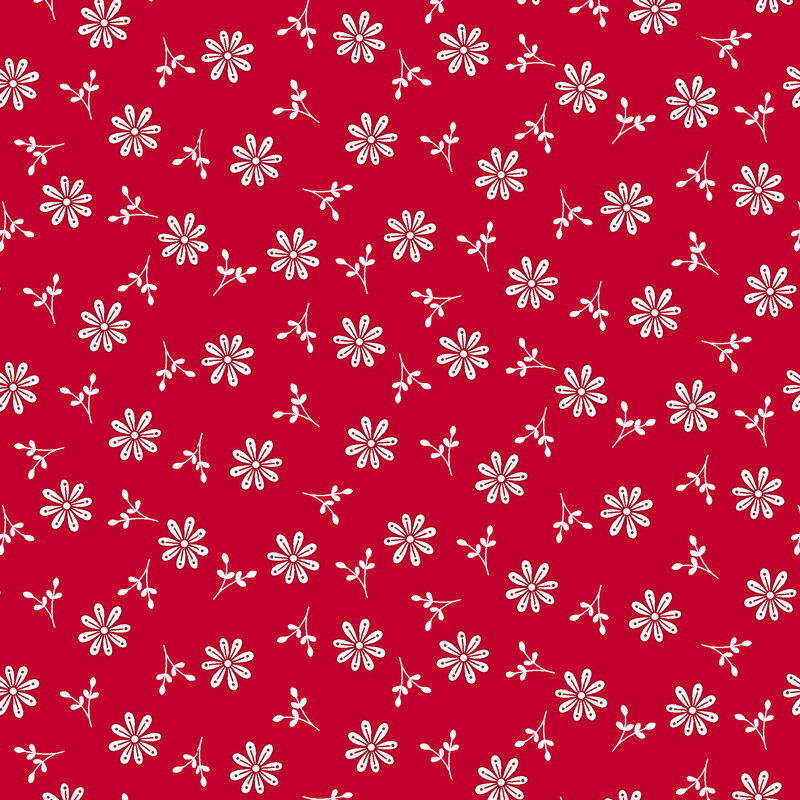 Fabric with various white flower shapes and small buds on a red background.