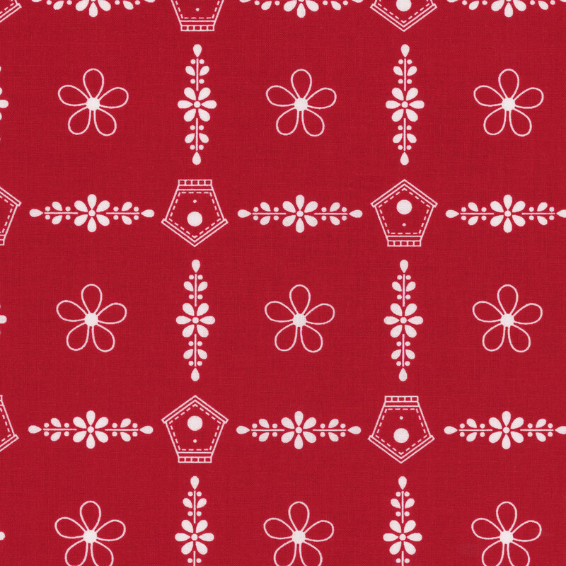 Fabric with crisp white florals and birdhouses on a red background, evenly repeated in a grid layout.