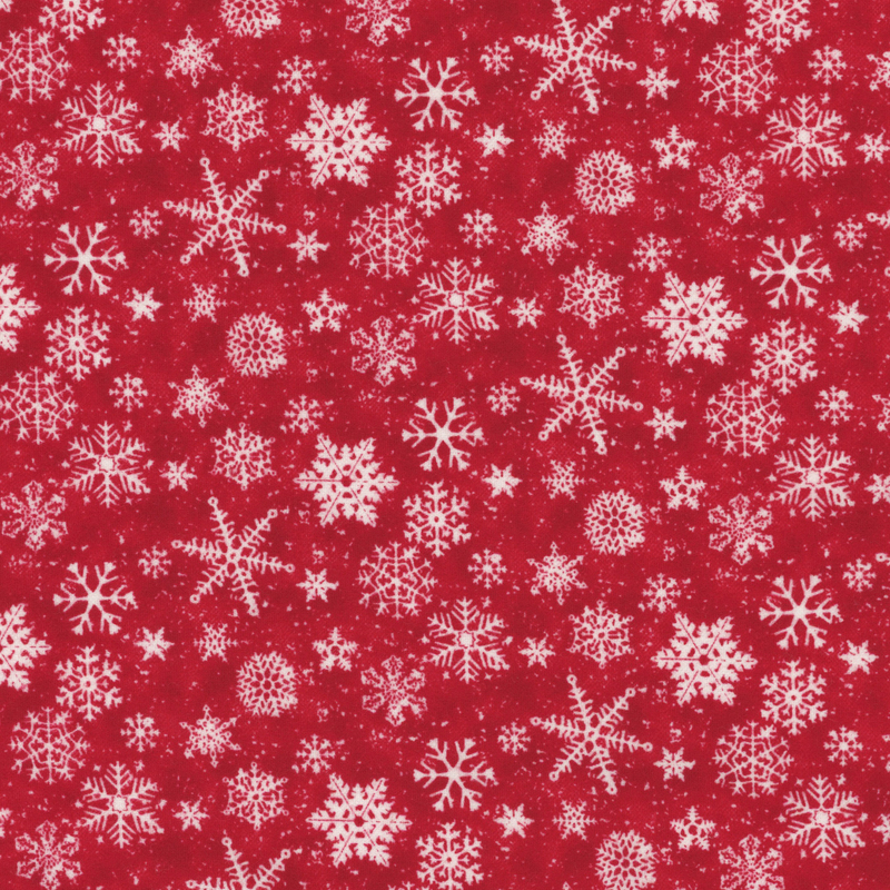 White snowflakes of various shapes and sizes scattered on a cherry red mottled background.