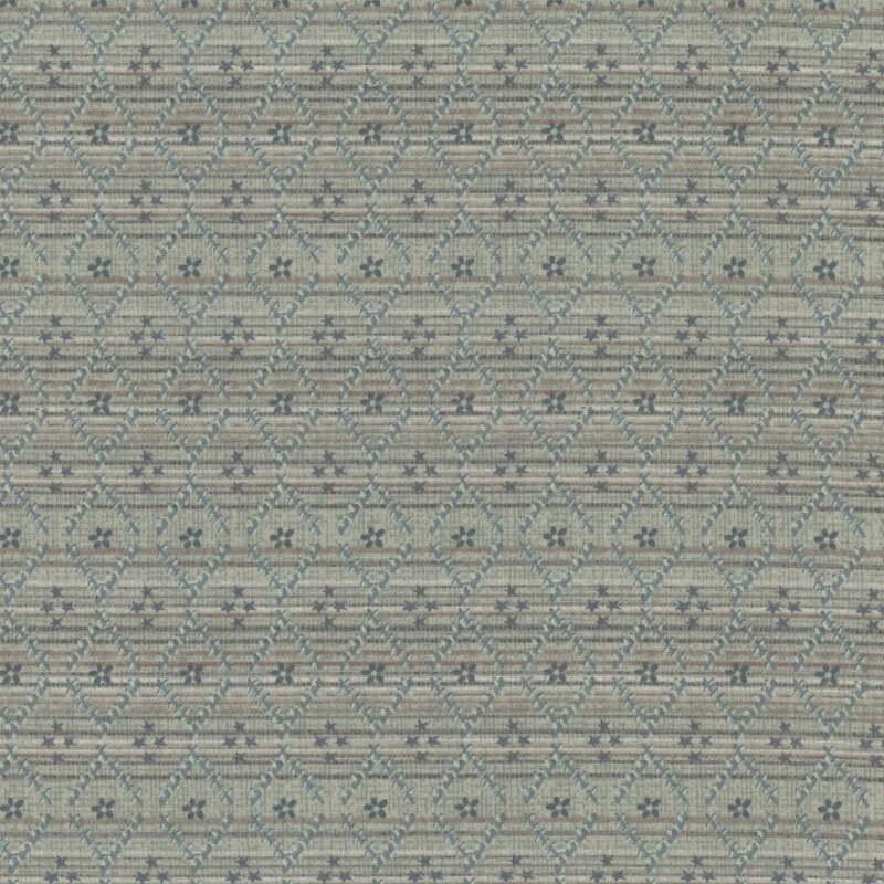 fabric pattern of textured interwoven lines and floral motifs on a blue background