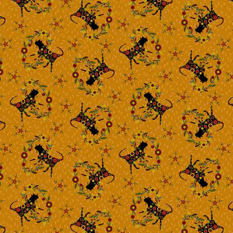 decorative fabric pattern of cats, stars, and motifs on a burnt orange background. 