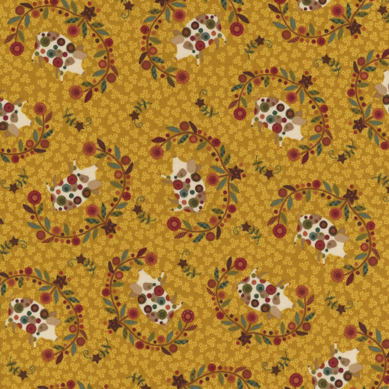 decorative fabric pattern of pigs, stars, and motifs on a burnt yellow background. 