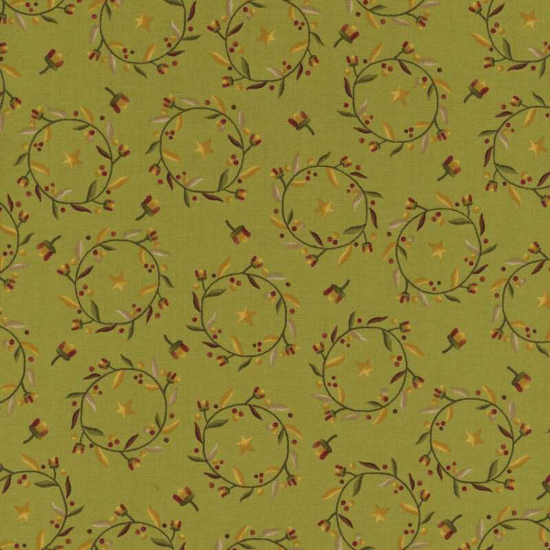 floral fabric of wreaths with berries on a green background