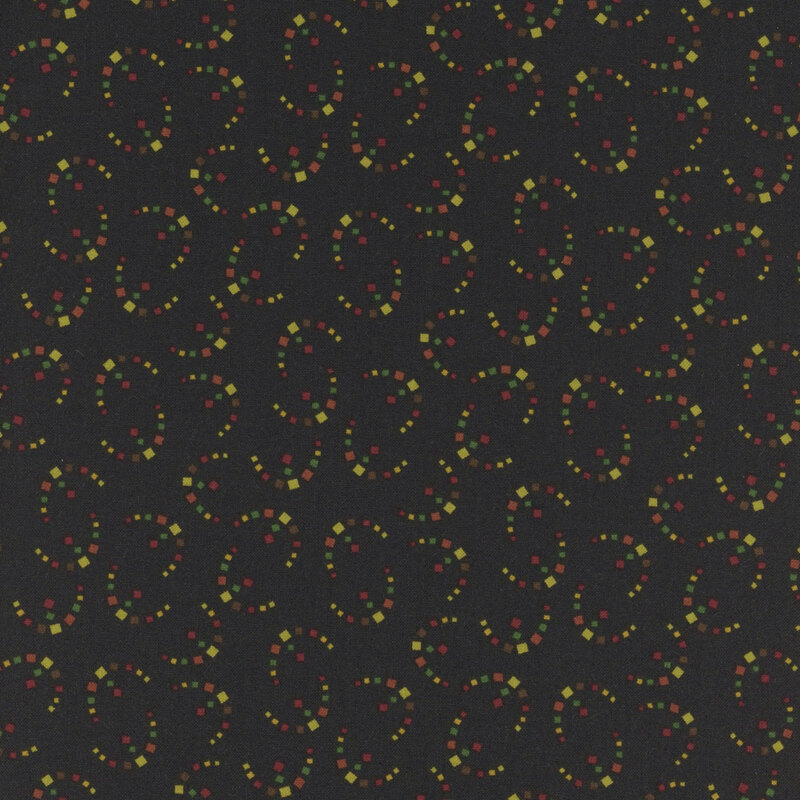 whimsical fabric pattern of shapes on a black background