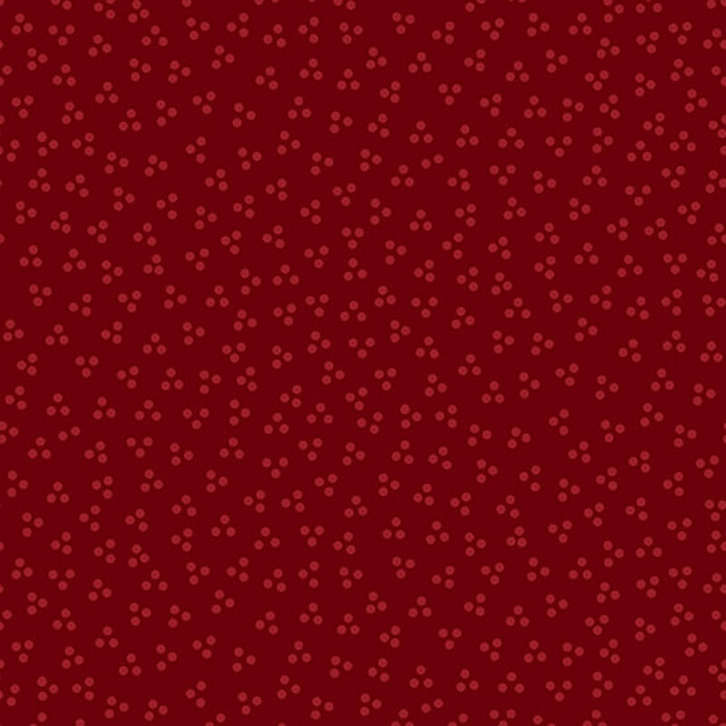 ditsy pattern of small tonal motifs on a red background