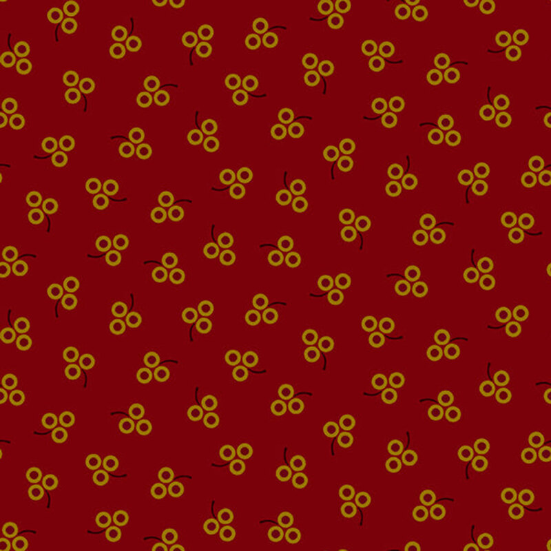 ditsy fabric pattern of berries on a red background