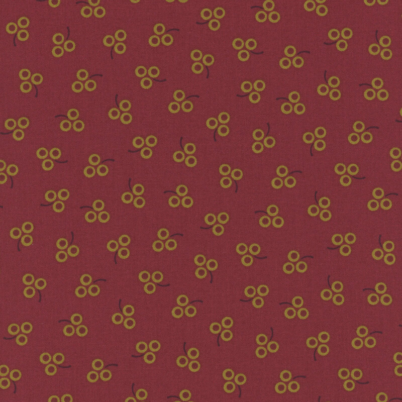ditsy fabric pattern of berries on a red background