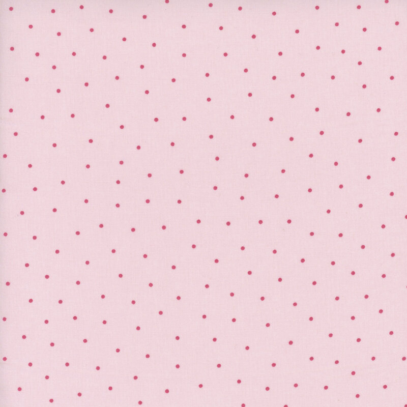 Pink fabric with evenly spaced red dots throughout