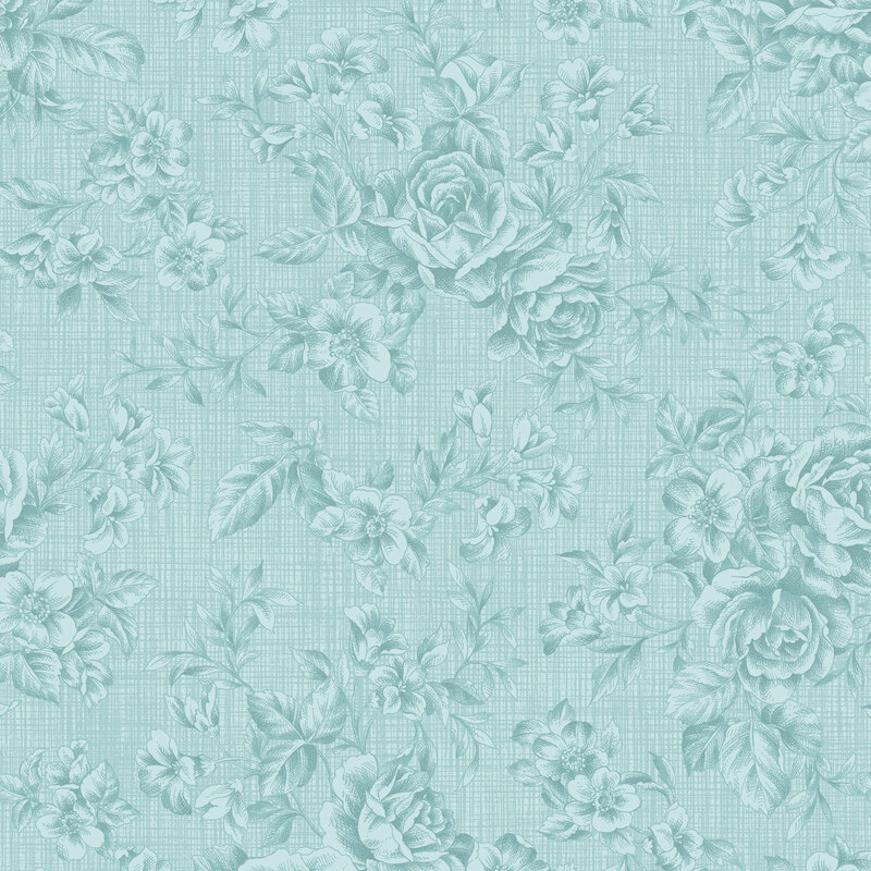 Tonal floral fabric pattern with a blue background, featuring roses and various small flowers.