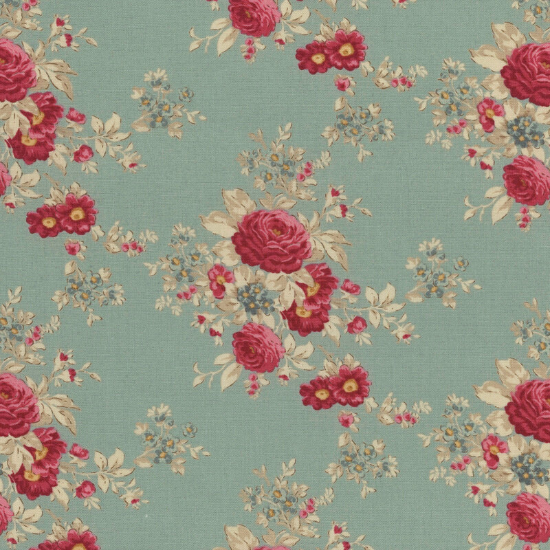 Floral pattern with red roses and small flowers on a muted blue fabric.