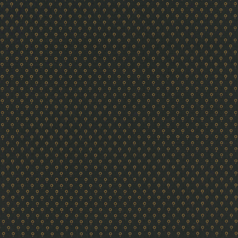 fabric pattern of golden dots on a black background
