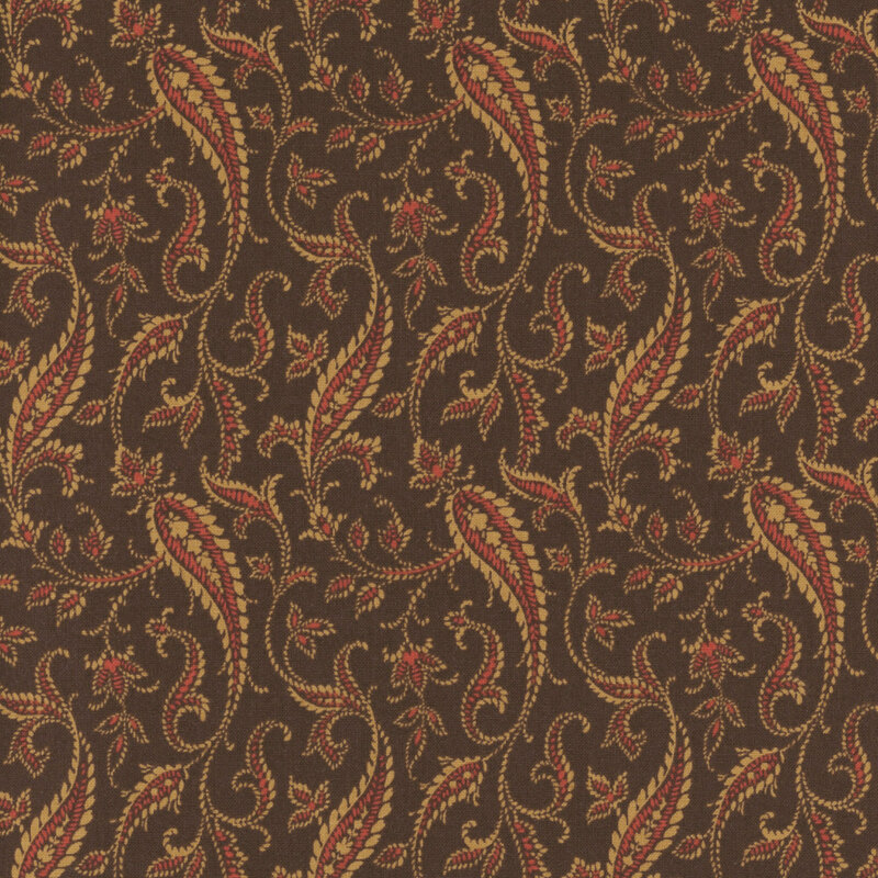 fabric pattern of red and tan paisley on a brown background
