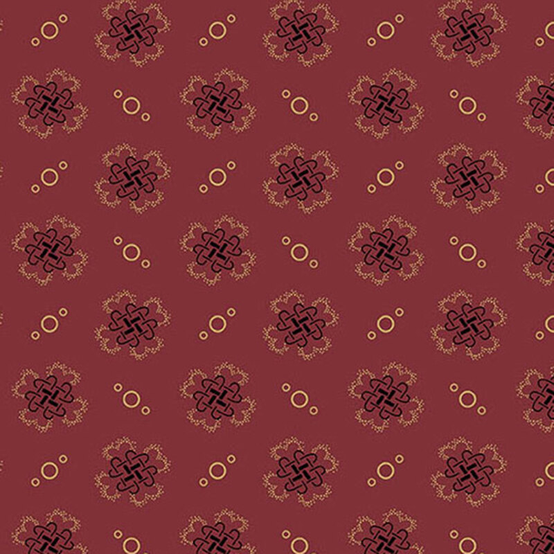 fabric pattern of golden threads of knots and circles on a red background