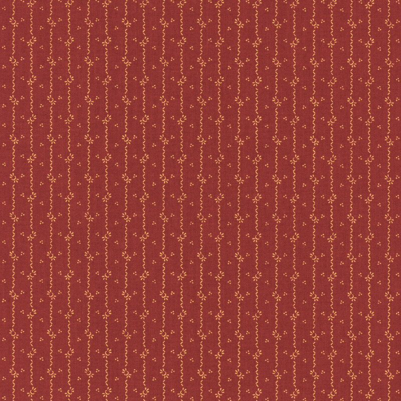 fabric pattern of curled stripes and motifs on a red background