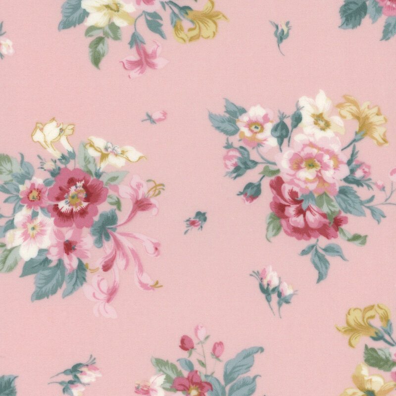 Pink fabric with bouquets of red, pink, and yellow florals with small sprigs tossed across the design.