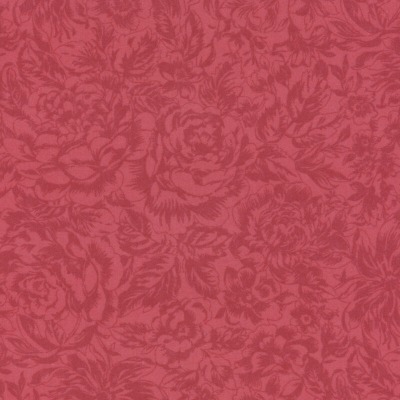 Red fabric with a tonal designs of large florals and leaves.