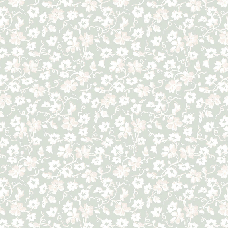 Pastel green fabric with a white pattern of florals and swirling vines.