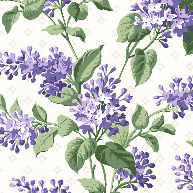 Cream fabric with large blooming lilacs on a diamond background.