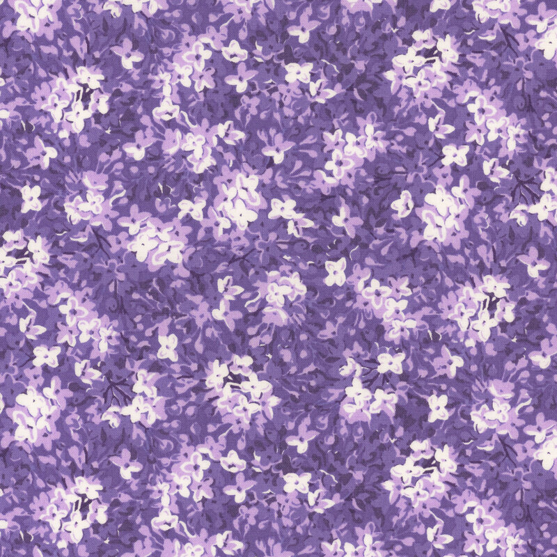 A packed design of lilac flowers on a purple fabric.