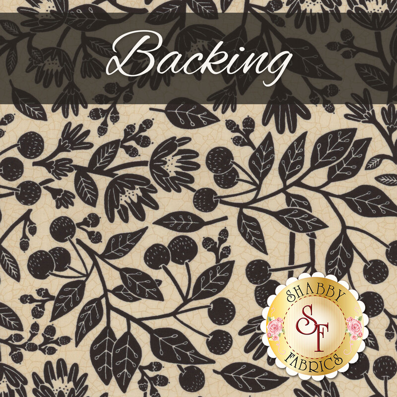 Textured cream fabric swatch with a sprawling black design of leaves, stylized florals, and berries. A black banner at the top reads 