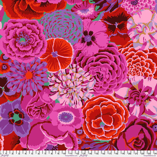 A vibrant arrangement of various flowers in shades of pink, red, and purple, with intricate details.