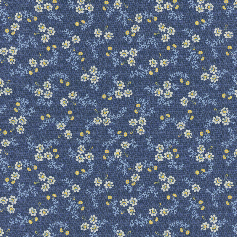 Fabric featuring small white flowers and blue leaves on a blue background.