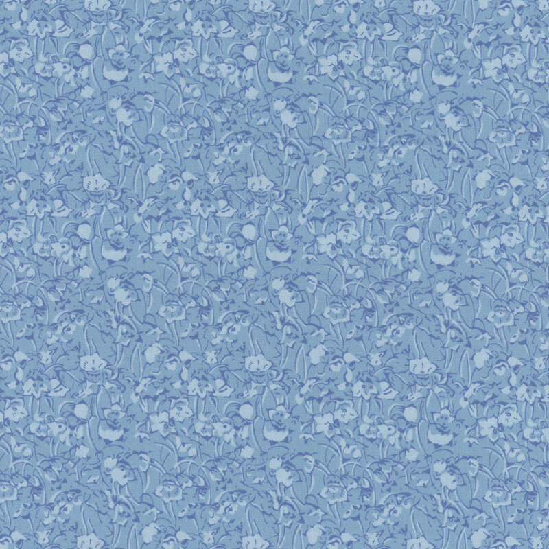 Tonal fabric featuring a floral pattern in shades of blue creating a textured look.