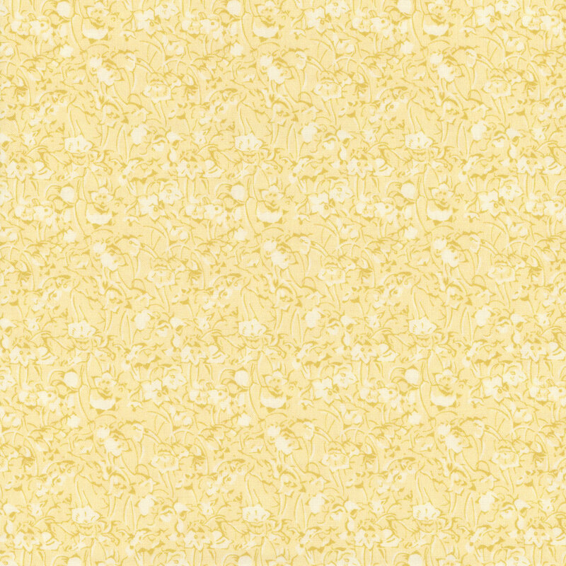 Tonal fabric featuring a floral pattern in shades of yellow creating a textured look.