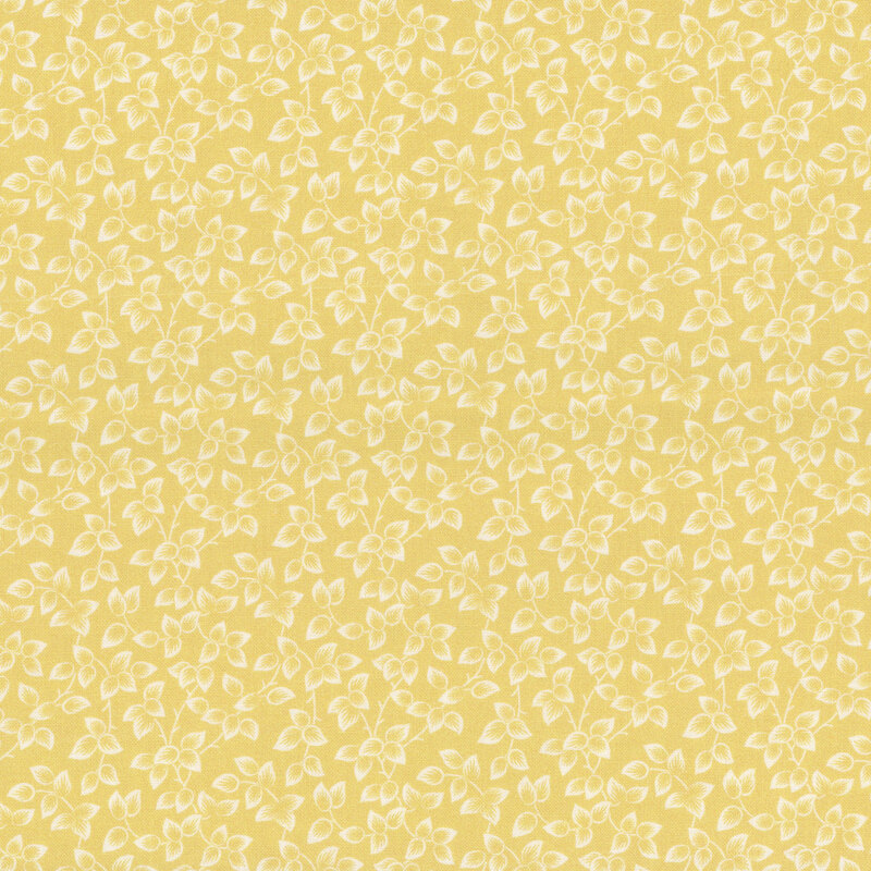 Yellow fabric packed with cream leaves