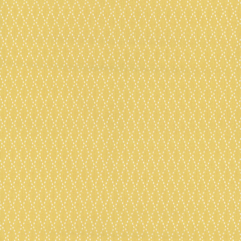 A textured yellow fabric with a repeating diamond pattern of small dots.