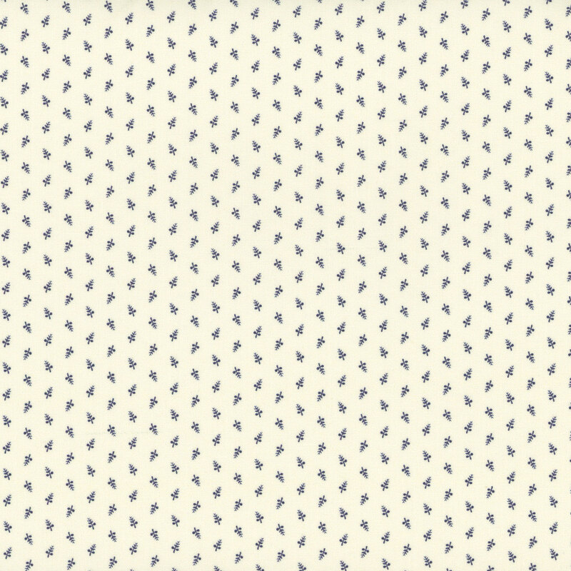 A repeating pattern of small blue sprigs on a cream background.