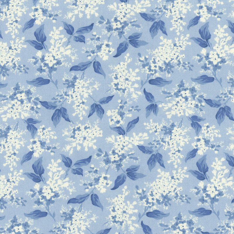 A floral pattern featuring cream flowers on a light blue background.