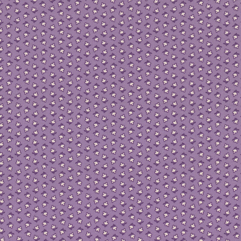 fabric pattern of white floral motifs on a purple background