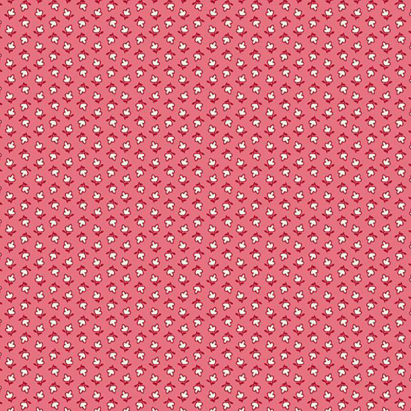 fabric pattern of white floral motifs on a pink background