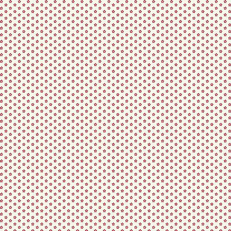 fabric pattern of red floral motifs on a white background