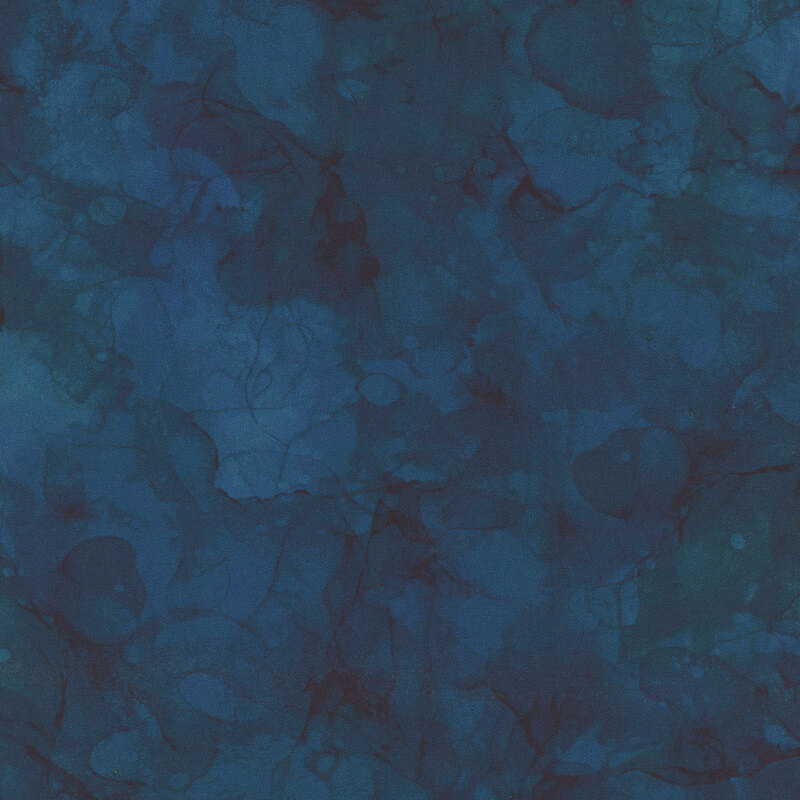 Dark blue watercolor fabric with tonal mottling.