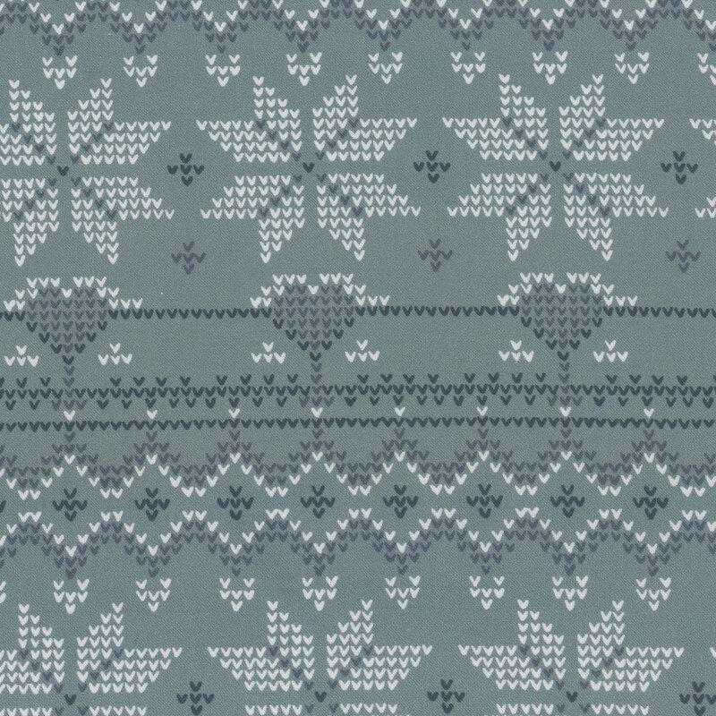 Knit fabric pattern featuring white snowflakes and geometric designs on a blue-green background.