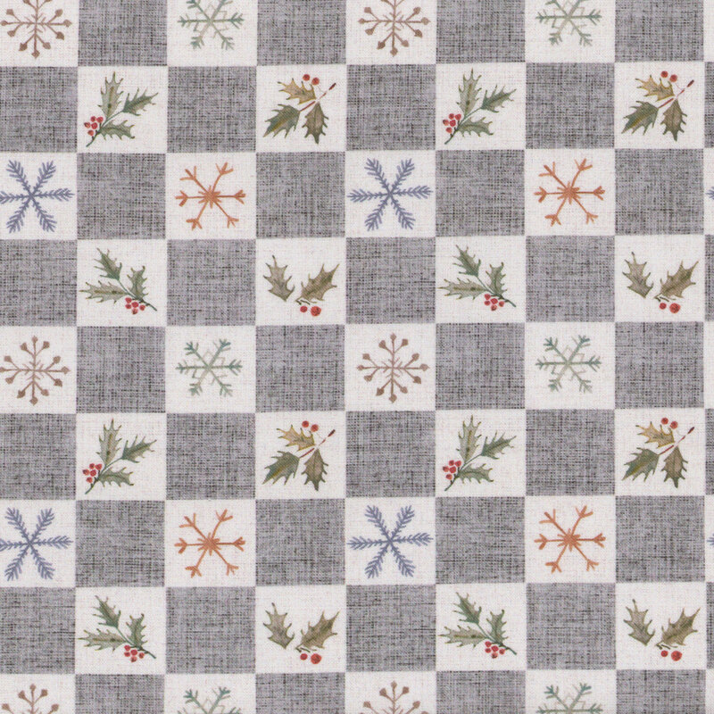 A patterned fabric with gray and white squares featuring snowflakes and holly branches.