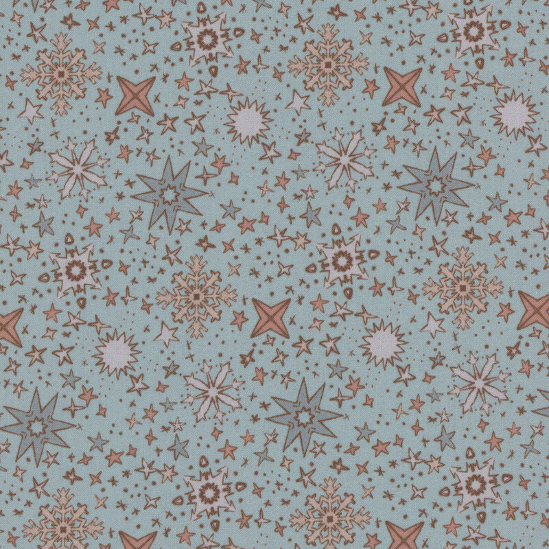 Fabric pattern with stars and snowflakes in various colors on a light blue background.