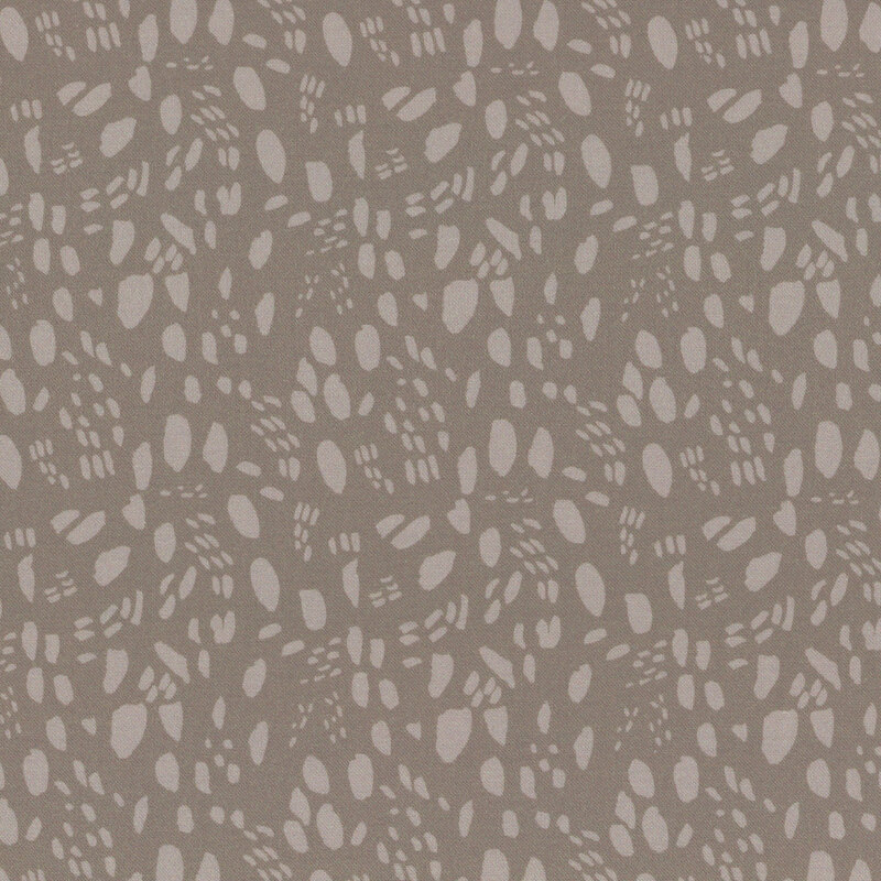 Brown abstract fabric pattern with irregular shapes and textures arranged uniformly.