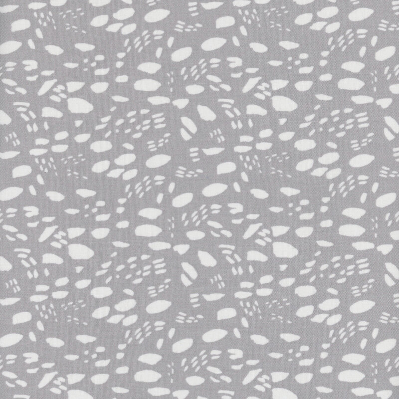 Tonal gray abstract fabric pattern with irregular shapes and textures arranged to mimic animal footprints.