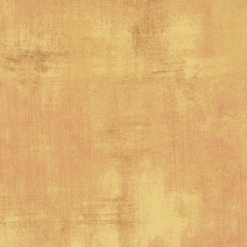 Textured gold background with varied shades and a subtle, brushed appearance.