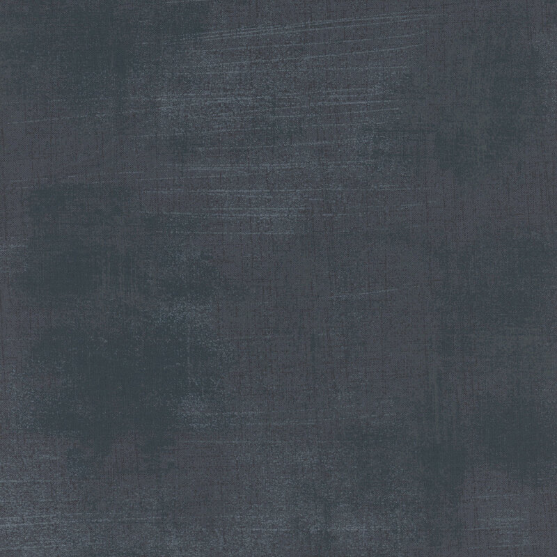 Abstract textured fabric in deep blue and gray tones, with a subtle brushstroke appearance.