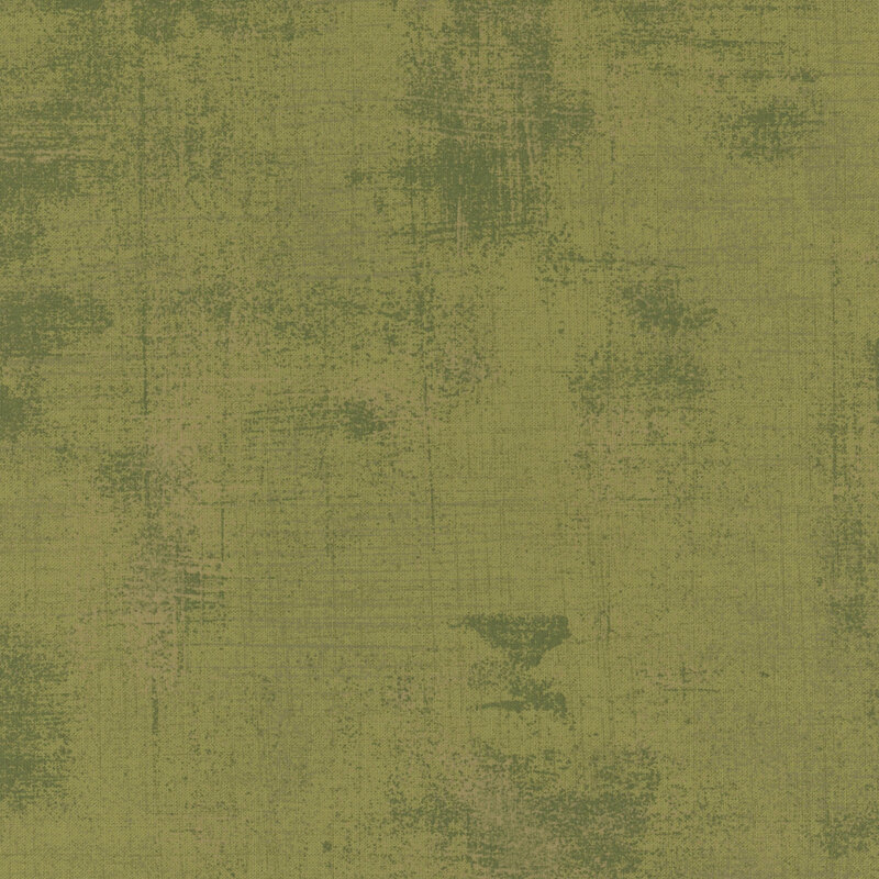 Fabric in muted green tones with subtle variations and imperfections.