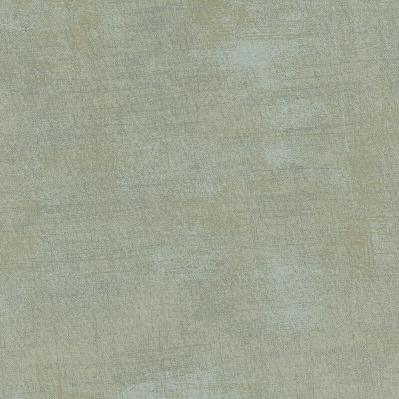 A smooth, textured surface in muted green tones with subtle variations in shade.